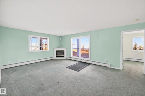 301 10511 42 Avenue, Edmonton, AB - Indoor Photo Showing Living Room With Fireplace