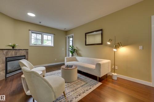 104 7907 109 Street, Edmonton, AB - Indoor Photo Showing Living Room With Fireplace