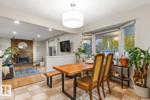 6815 11 Avenue, Edmonton, AB - Indoor Photo Showing Dining Room With Fireplace
