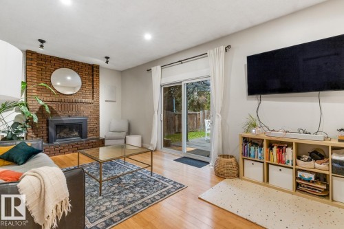 6815 11 Avenue, Edmonton, AB - Indoor Photo Showing Living Room With Fireplace