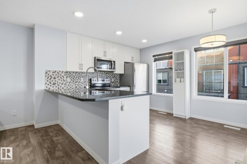 111 3305 Orchards Link, Edmonton, AB - Indoor Photo Showing Kitchen With Upgraded Kitchen