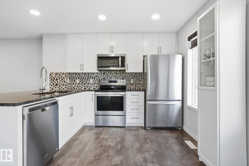 111 3305 Orchards Link, Edmonton, AB - Indoor Photo Showing Kitchen With Stainless Steel Kitchen With Upgraded Kitchen