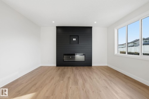 721 Astoria Way, Devon, AB - Indoor Photo Showing Living Room With Fireplace