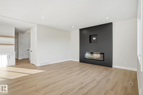 721 Astoria Way, Devon, AB - Indoor Photo Showing Living Room With Fireplace