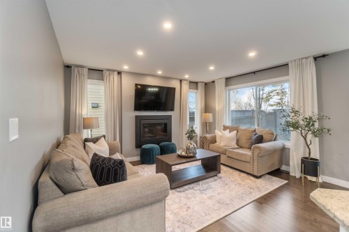 8306 180A Avenue, Edmonton, AB - Indoor Photo Showing Living Room With Fireplace