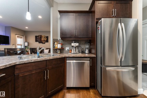 86 8602 Southfort Boulevard, Fort Saskatchewan, AB - Indoor Photo Showing Kitchen With Double Sink