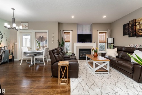 86 8602 Southfort Boulevard, Fort Saskatchewan, AB - Indoor Photo Showing Living Room With Fireplace
