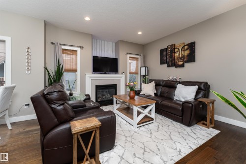 86 8602 Southfort Boulevard, Fort Saskatchewan, AB - Indoor Photo Showing Living Room With Fireplace