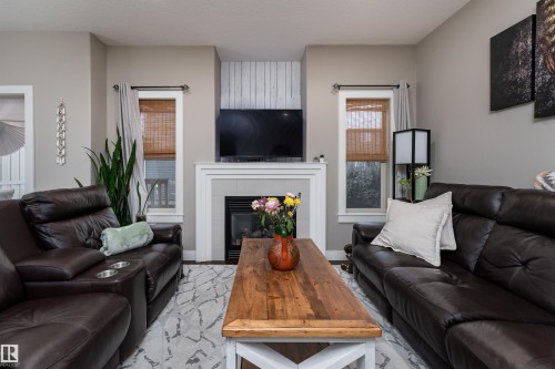 86 8602 Southfort Boulevard, Fort Saskatchewan, AB - Indoor Photo Showing Living Room With Fireplace