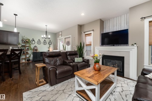 86 8602 Southfort Boulevard, Fort Saskatchewan, AB - Indoor Photo Showing Living Room With Fireplace