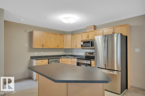 322 16303 95 Street, Edmonton, AB - Indoor Photo Showing Kitchen With Double Sink