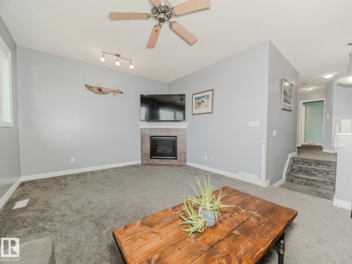 109 Rue Moreau, Beaumont, AB - Indoor Photo Showing Living Room With Fireplace