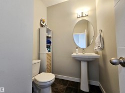 Half bath featuring baseboards and toilet - 