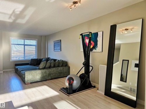 Exercise room with wood finished floors - 83 600 Bellerose Drive, St. Albert, AB - Indoor Photo Showing Living Room