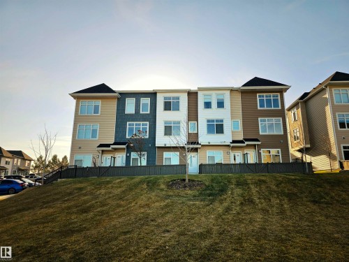 View of property with a residential view - 83 600 Bellerose Drive, St. Albert, AB - Outdoor With Facade