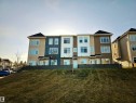 View of property with a residential view - 83 600 Bellerose Drive, St. Albert, AB  - Outdoor With Facade 