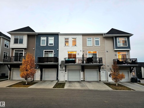 View of front of property featuring a balcony and driveway - 83 600 Bellerose Drive, St. Albert, AB - Outdoor With Deck Patio Veranda With Facade