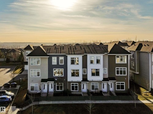 Back of house at dusk with a residential view - 83 600 Bellerose Drive, St. Albert, AB - Outdoor With Facade