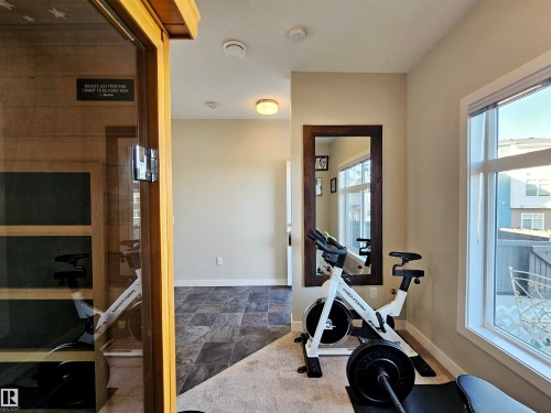Workout area featuring a sauna / steam room and dark stone finish floors - 83 600 Bellerose Drive, St. Albert, AB - Indoor Photo Showing Gym Room