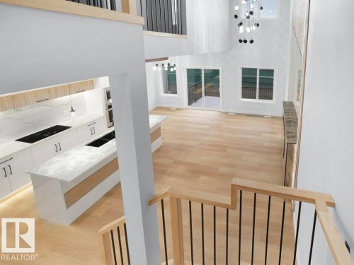 Stairway featuring wood finished floors, a towering ceiling, and a chandelier - 15419 20 Street, Edmonton, AB - Indoor Photo Showing Other Room