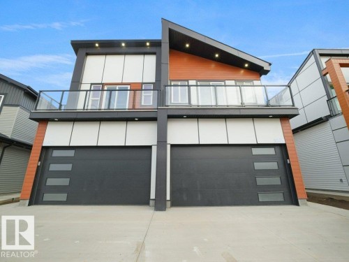 View of front of home with driveway, a balcony, and an attached garage - 15419 20 Street, Edmonton, AB - Outdoor