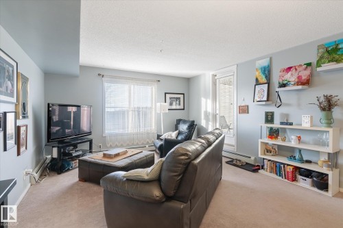115 3315 James Mowatt Trail, Edmonton, AB - Indoor Photo Showing Living Room
