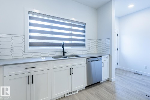 2929 Coughlan Green, Edmonton, AB - Indoor Photo Showing Kitchen With Double Sink