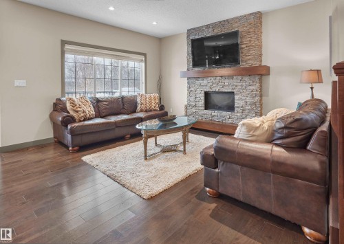 5703 Edworthy Landing, Edmonton, AB - Indoor Photo Showing Living Room With Fireplace