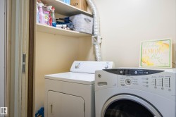 Laundry area featuring separate washer and dryer - 
