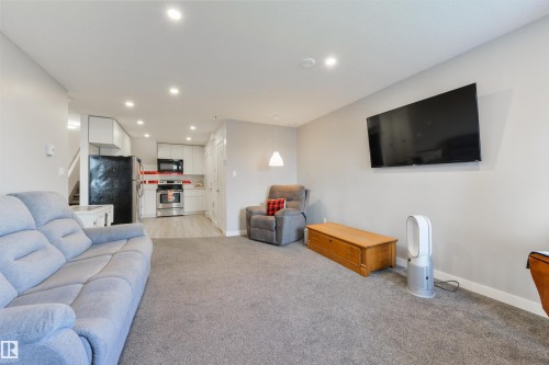 63 Dalquist Bay, Leduc, AB - Indoor Photo Showing Living Room