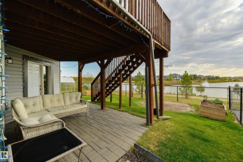 63 Dalquist Bay, Leduc, AB - Outdoor With Body Of Water With Deck Patio Veranda With Exterior
