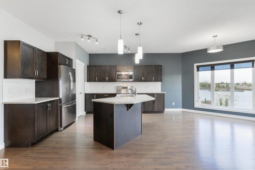 63 Dalquist Bay, Leduc, AB - Indoor Photo Showing Kitchen With Upgraded Kitchen