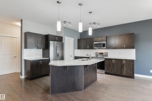 63 Dalquist Bay, Leduc, AB - Indoor Photo Showing Kitchen With Upgraded Kitchen