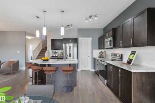 63 Dalquist Bay, Leduc, AB - Indoor Photo Showing Kitchen With Upgraded Kitchen