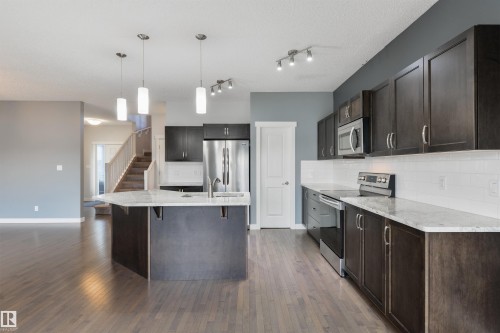 63 Dalquist Bay, Leduc, AB - Indoor Photo Showing Kitchen With Upgraded Kitchen