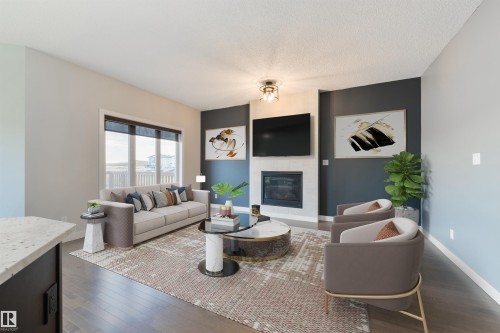 63 Dalquist Bay, Leduc, AB - Indoor Photo Showing Living Room With Fireplace