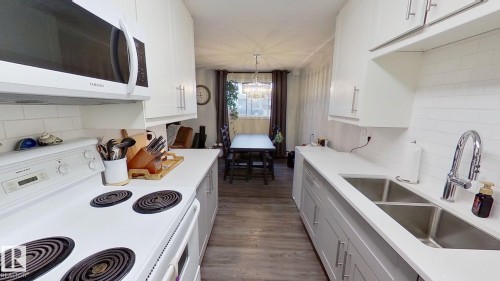 101 15930 109 Avenue, Edmonton, AB - Indoor Photo Showing Kitchen With Double Sink