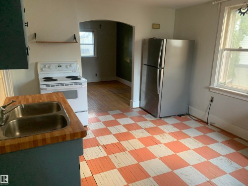 9747 90 Avenue, Edmonton, AB - Indoor Photo Showing Kitchen With Double Sink