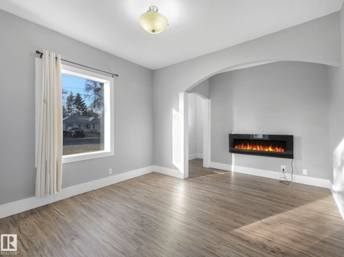 4315 52 Street, Wetaskiwin, AB - Indoor Photo Showing Living Room With Fireplace