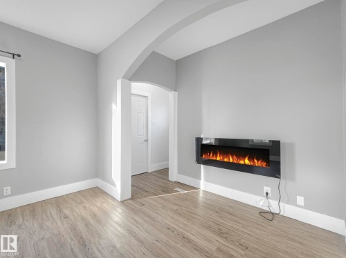 4315 52 Street, Wetaskiwin, AB - Indoor Photo Showing Living Room With Fireplace