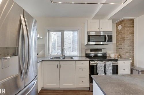 11227 69 Street, Edmonton, AB - Indoor Photo Showing Kitchen With Stainless Steel Kitchen With Double Sink