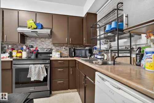 77 7604 29 Avenue, Edmonton, AB - Indoor Photo Showing Kitchen With Double Sink