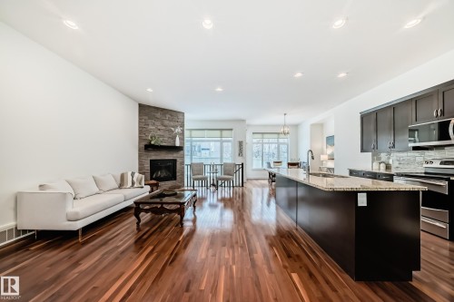 6107 Maynard Crescent, Edmonton, AB - Indoor Photo Showing Kitchen With Fireplace With Upgraded Kitchen