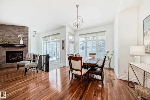 6107 Maynard Crescent, Edmonton, AB - Indoor Photo Showing Dining Room With Fireplace