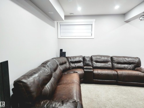 Carpeted living room featuring recessed lighting - 1357 Watt Drive, Edmonton, AB - Indoor