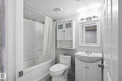Bathroom with shower / bathtub combination with curtain and vanity - 