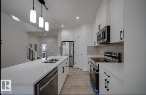 305 26St, Edmonton, AB - Indoor Photo Showing Kitchen With Double Sink With Upgraded Kitchen