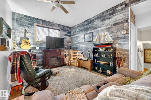 4664 16A Avenue, Edmonton, AB - Indoor Photo Showing Other Room With Fireplace