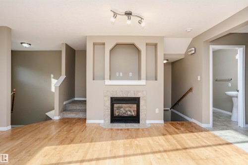 204 178 Bridgeport Boulevard, Leduc, AB - Indoor Photo Showing Living Room With Fireplace