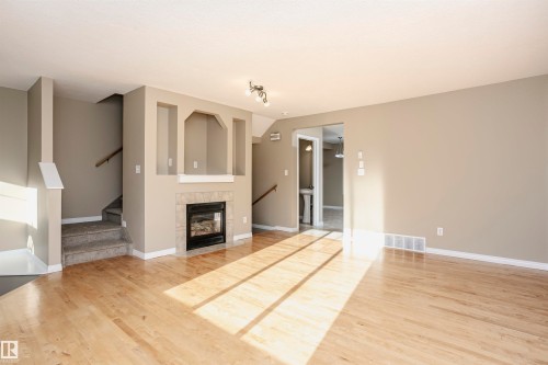 204 178 Bridgeport Boulevard, Leduc, AB - Indoor Photo Showing Living Room With Fireplace